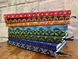 notebooks covered with shwe shwe fabrics