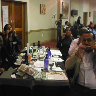 People having fun with toys they made from waste